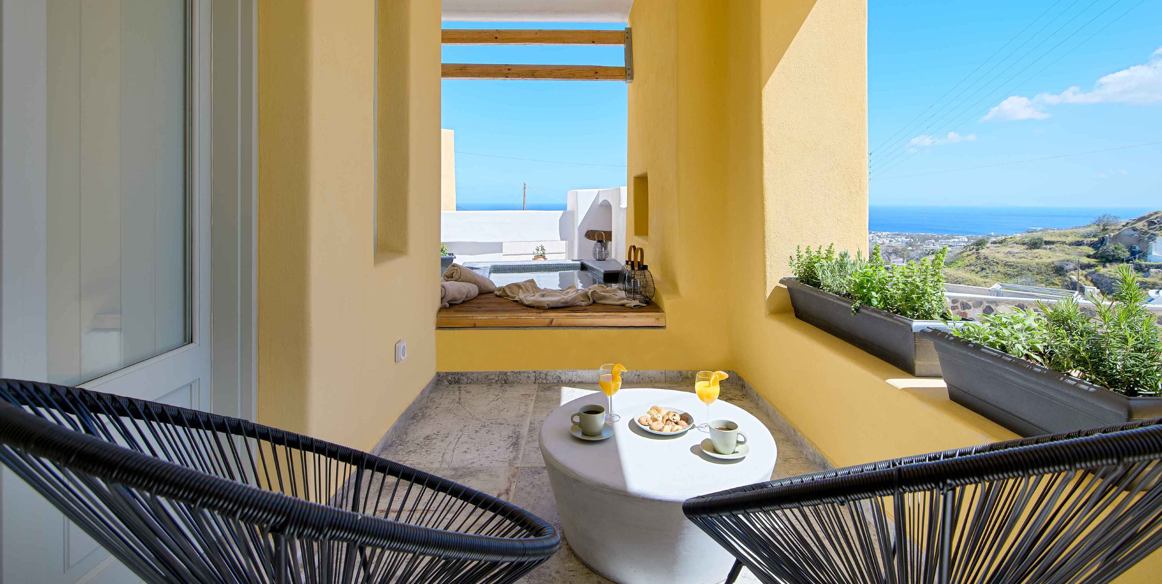 Experience luxury & comfort at Villas Geminos.Picture of the resort's balcony overlooking the Aegean sea.